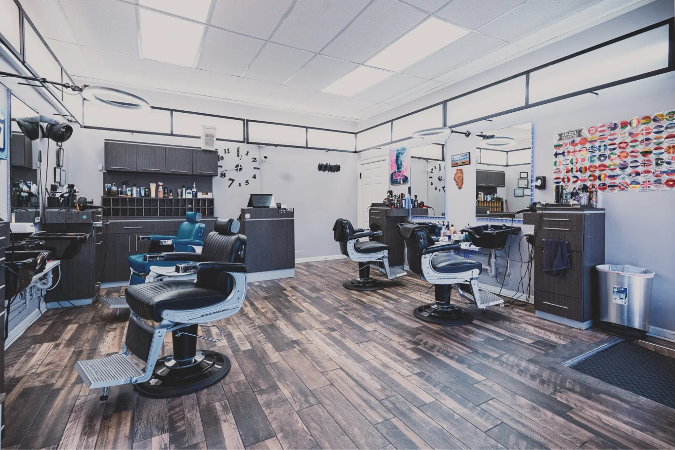 Inside W Hair Room barbershop in Wrigleyville, Chicago — barber chairs, stations, and warm wood floors